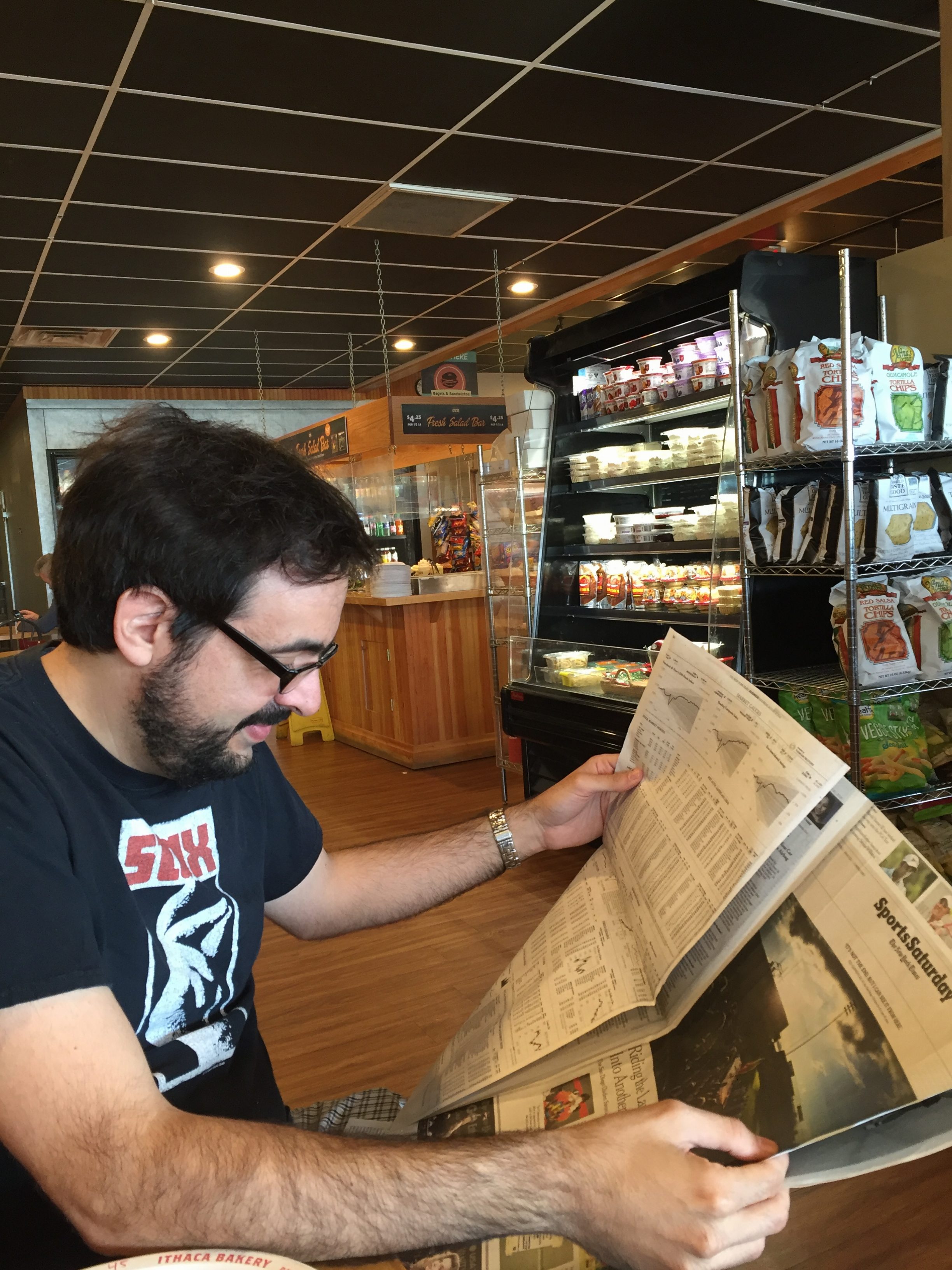 Pete Croatto reading the paper.